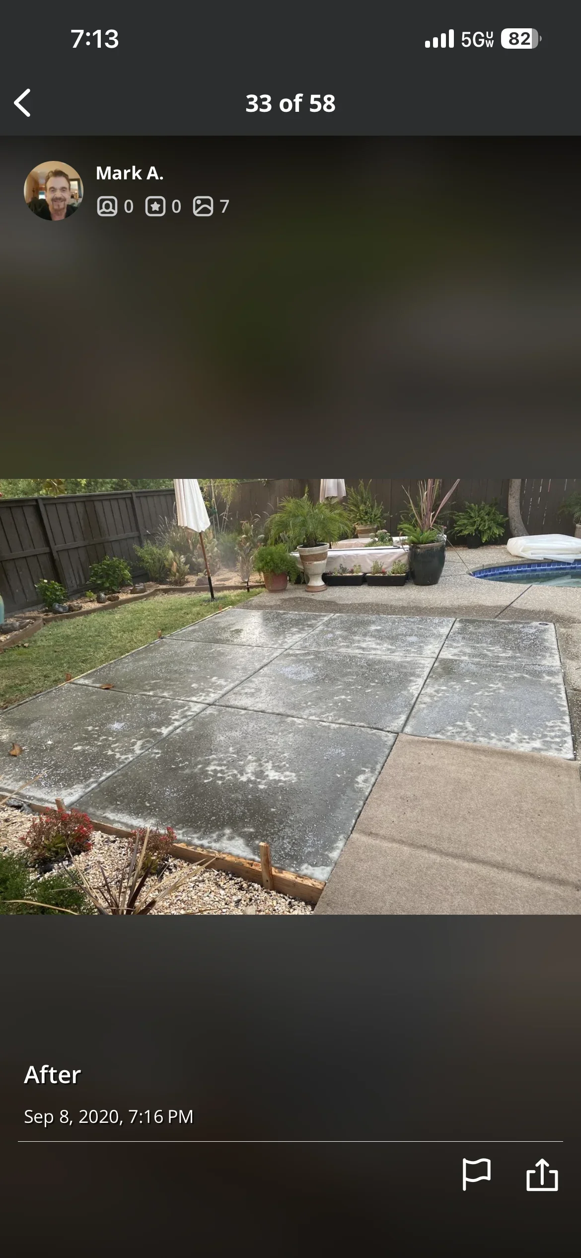 Finished concrete patio with multiple sections in residential backyard with pool and landscaping