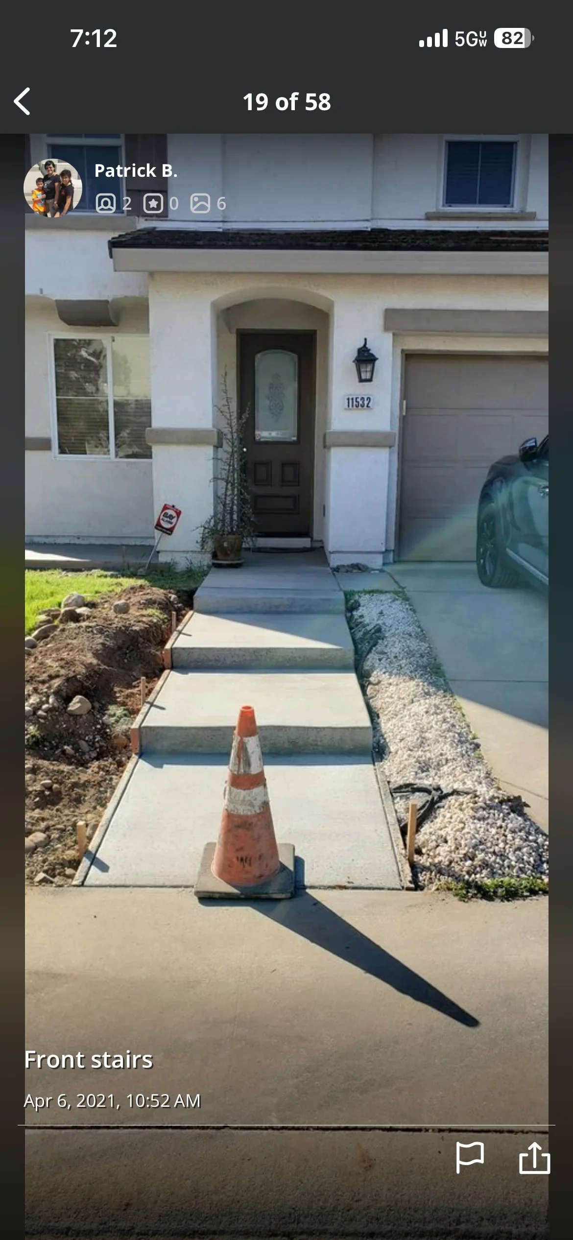 New concrete walkway with stepped entry stairs leading to residential front door